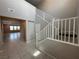 Inviting foyer showcasing staircase and sightlines into sunlit rooms highlighting the home's layout at 2620 Tolmezzo St, Henderson, NV 89044