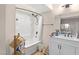 Bright bathroom with a shower/tub, white vanity and wood look floors at 2643 Red Rock St # 201, Las Vegas, NV 89146