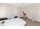Bedroom with neutral walls, carpet flooring and exercise equipment at 2643 Red Rock St # 201, Las Vegas, NV 89146