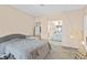 Bright bedroom featuring neutral colored walls, soft carpet, and ensuite bathroom at 2643 Red Rock St # 201, Las Vegas, NV 89146