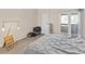 Bedroom with neutral walls, carpet flooring and glass doors leading to an outdoor balcony at 2643 Red Rock St # 201, Las Vegas, NV 89146