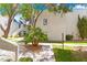Cozy condo complex featuring well-maintained landscaping and mature trees at 2643 Red Rock St # 201, Las Vegas, NV 89146
