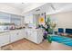 Inviting kitchen boasts light wood floors, lots of natural light, and breakfast bar at 2643 Red Rock St # 201, Las Vegas, NV 89146