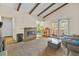 Open concept living room with fireplace, high ceilings, and adjacent dining area at 2643 Red Rock St # 201, Las Vegas, NV 89146