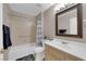 Bathroom featuring a shower-tub combo, toilet, and vanity with a large mirror at 2701 Glencliff Dr, Las Vegas, NV 89134