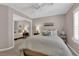 Bedroom with neutral tones, a plush bed, and a mirrored closet adding depth at 2701 Glencliff Dr, Las Vegas, NV 89134