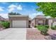 Charming single-story home with a two-car garage, manicured landscaping, and a well-maintained front yard at 2701 Glencliff Dr, Las Vegas, NV 89134