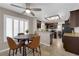 Eat-in kitchen area with granite countertops, stainless steel appliances, and an adjacent dining area at 2701 Glencliff Dr, Las Vegas, NV 89134