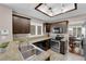 Modern kitchen features granite countertops, stainless steel appliances, and a seamless connection to the dining area at 2701 Glencliff Dr, Las Vegas, NV 89134