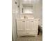 Bathroom featuring a white vanity with storage cabinets, modern fixtures, and tiled floors at 2813 Painted Rose Ln, Henderson, NV 89074