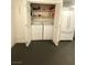 Laundry closet featuring a washer, dryer, and shelving at 2813 Painted Rose Ln, Henderson, NV 89074