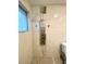 Bathroom featuring a sleek shower system with multiple jets and tiled surround at 2813 Painted Rose Ln, Henderson, NV 89074