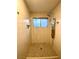 Tiled shower with multiple jets, tiled walls, modern fixtures, and a window at 2813 Painted Rose Ln, Henderson, NV 89074