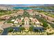 An aerial view showcasing the community pool, clubhouse, and lush landscaping near the golf course at 30 Via Vasari # 103, Henderson, NV 89011
