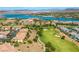 View of lakefront homes on a golf course with tiled rooftops at 30 Via Vasari # 103, Henderson, NV 89011