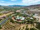 Aerial view of the community showcasing the pool, clubhouse, landscaping, and golf course at 30 Via Vasari # 103, Henderson, NV 89011