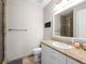 Bathroom with granite countertops, white cabinets, shower and toilet at 30 Via Vasari # 103, Henderson, NV 89011