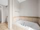 Relaxing bathroom featuring a standalone soaking tub with tile surround at 30 Via Vasari # 103, Henderson, NV 89011