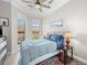 Cozy bedroom with natural light, neutral paint, and ceiling fan at 30 Via Vasari # 103, Henderson, NV 89011