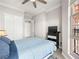 Comfortable bedroom features a ceiling fan, closet, and dresser at 30 Via Vasari # 103, Henderson, NV 89011