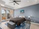 Spacious bedroom with balcony access and scenic outdoor views at 30 Via Vasari # 103, Henderson, NV 89011