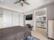 Bedroom with an entertainment system, ceiling fan and ensuite bathroom at 30 Via Vasari # 103, Henderson, NV 89011