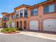 Charming townhome with a two-car garage, manicured landscaping, and covered entryway in a desirable community at 30 Via Vasari # 103, Henderson, NV 89011