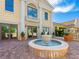 Beautiful courtyard with a tranquil fountain and refined architecture and landscape at 30 Via Vasari # 103, Henderson, NV 89011