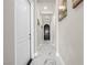 Elegant hallway featuring stylish marble floors and neutral decor, leading to various rooms in the home at 30 Via Vasari # 103, Henderson, NV 89011
