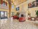 Elegant living room with travertine flooring and cozy seating area at 30 Via Vasari # 103, Henderson, NV 89011