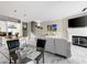 Open living space boasts modern decor, a fireplace, and a combined dining and kitchen area at 30 Via Vasari # 103, Henderson, NV 89011