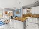 Inviting open-concept space features a modern kitchen, comfortable seating, and stylish decor with plenty of natural light at 30 Via Vasari # 103, Henderson, NV 89011