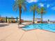 Outdoor pool area featuring palm trees and lounging areas at 30 Via Vasari # 103, Henderson, NV 89011