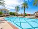 Luxurious community pools and sundeck complemented by palm trees and refined architecture at 30 Via Vasari # 103, Henderson, NV 89011