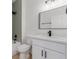 Well-lit bathroom with modern vanity, black fixtures, and tiled shower-tub combination at 3318 N Decatur Blvd # 1020, Las Vegas, NV 89130