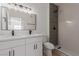 A bathroom featuring a modern double sink vanity and tiled walk-in shower at 3318 N Decatur Blvd # 1020, Las Vegas, NV 89130
