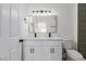 The bathroom boasts a double vanity, large mirror, and a tiled stand-up shower at 3318 N Decatur Blvd # 1020, Las Vegas, NV 89130