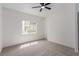 A bright bedroom has a ceiling fan and window that allows in natural light at 3318 N Decatur Blvd # 1020, Las Vegas, NV 89130