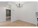 Bright dining area with modern chandelier and view of the bathroom at 3318 N Decatur Blvd # 1020, Las Vegas, NV 89130
