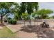 Community dog park provides a secure, fenced area with benches and shaded trees at 3318 N Decatur Blvd # 1020, Las Vegas, NV 89130