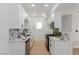 Modern kitchen with white cabinets, stainless steel appliances, and stylish backsplash at 3318 N Decatur Blvd # 1020, Las Vegas, NV 89130