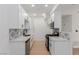 Stylish kitchen featuring white cabinets, granite countertops, and stainless steel appliances at 3318 N Decatur Blvd # 1020, Las Vegas, NV 89130