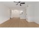 Open-concept living space boasting modern chandelier, wood-look flooring, and neutral wall color at 3318 N Decatur Blvd # 1020, Las Vegas, NV 89130