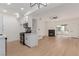 Open-concept living room with modern fireplace, ceiling fan, and sliding glass doors at 3318 N Decatur Blvd # 1020, Las Vegas, NV 89130