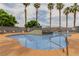 Community pool featuring a gradual entrance, waterfall feature, and several lounge chairs at 3318 N Decatur Blvd # 1020, Las Vegas, NV 89130