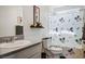 Bathroom featuring a Mickey Mouse themed shower curtain, sink, toilet and artwork at 3531 Montepulciano Ln, Henderson, NV 89044