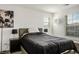 Inviting bedroom featuring a comfortable bed, nightstands with lamps, and natural light at 3531 Montepulciano Ln, Henderson, NV 89044