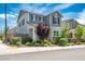 Inviting two-story home with well-manicured landscaping, a covered porch, and a neatly paved sidewalk at 3531 Montepulciano Ln, Henderson, NV 89044
