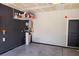 Organized garage area featuring shelving and a door leading to another area at 3531 Montepulciano Ln, Henderson, NV 89044