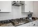 Well-equipped kitchen with granite counters, stainless steel appliances, and a gas cooktop at 3531 Montepulciano Ln, Henderson, NV 89044
